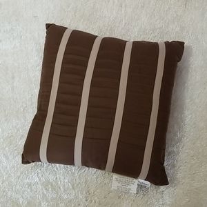 Brown and cream accent pillow